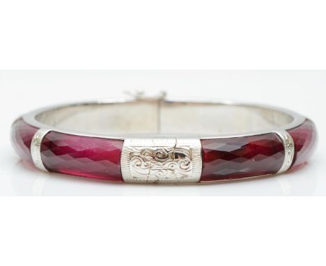 A silver and synthetic ruby hinged bangle, inner diameter 56mm, 35gm 