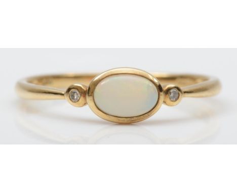 A 9ct gold opal and diamond three stone ring, O 1/2, 1.3gm 