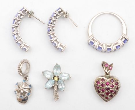 A silver and tanzanite ring, N 1/2, a matching pair of ear rings and three pendants, 23gm 