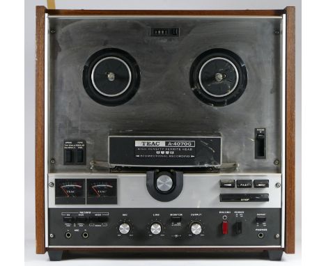 A Teac A-4070G reel to reel stereo tape deck, with original manual 