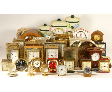 A collection of quartz and mechanical clocks, to include a John Thomas bracket clock with moon phase, a Denby Mint Arsenal AF