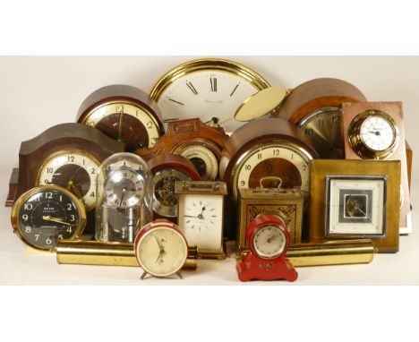 A collection of mechanical and quartz clocks, including anniversary, mantel, wall, ceramic, alarm clocks and others, includin