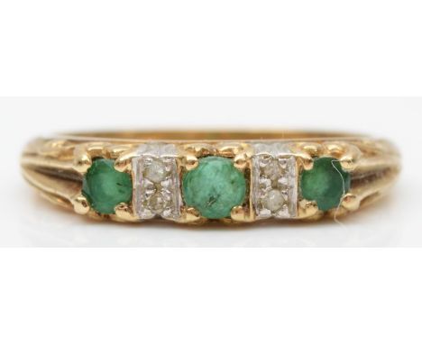 A 9ct gold vintage three stone emerald and diamond ring, L, 2.2gm 