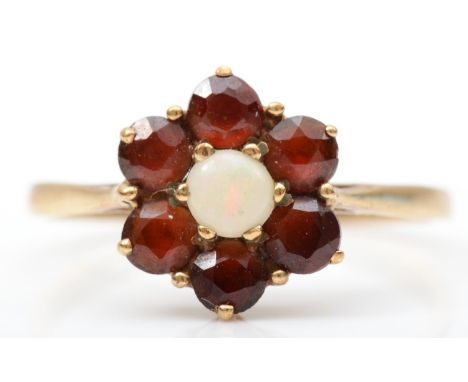 A 9ct gold opal and garnet cluster ring, M 1/2, 1.4gm 