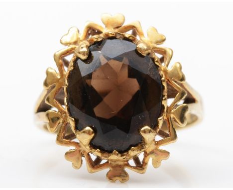 A 9ct gold and smokey quartz dress ring, stone 13 x 11mm, N, 4gm 