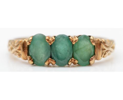 A 9ct gold and three stone beryl ring, P, 2gm 