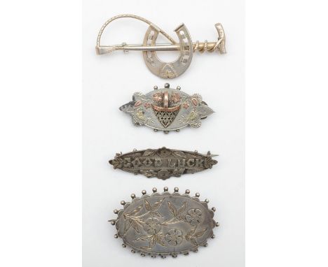 A Victorian silver hunting brooch, Birmingham 1876 and three other Victorian silver brooches, 25gm 