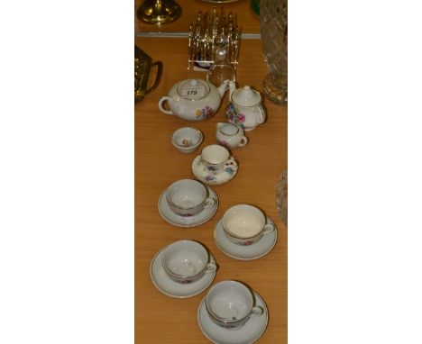 Ceramics - a miniature tea service, painted with flowers, comprising teapot, sugar bowl, teacups and saucers;  a miniature ma