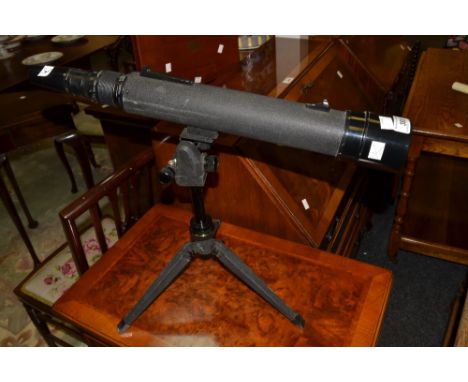 A Tasco telescope, on tripod