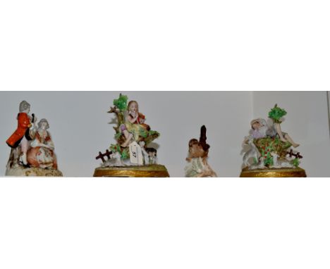A pair of Sitzendorf figures, of a young shepherd and shepherdess, she playing the flute, he sleeping, oval bases, printed ma