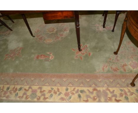 A large moss green patterned carpet, 373cm x 276cm