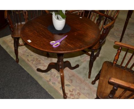 A George III circular occasional table, turned column, tripod base, pad feet, c.1800