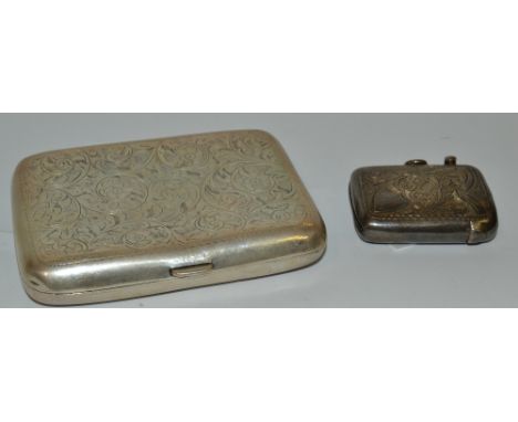A silver cigarette case, engraved with floral scrolls, Birmingham, 1939;  an Edwardian vesta case Birmingham 1903 (2)