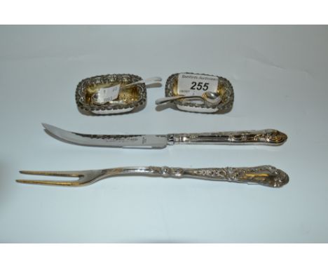 A pair of silver rounded rectangular salts, gilded interiors, embossed with C-scrolls, Birmingham 1899;  a pair of silver sal