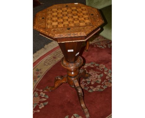 A Victorian walnut octagonal sewing table, the top inlaid in coloured woods, tapering column, tripod legs, c.1870
