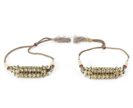 A pair of diamond-set enamelled gold bazubands North India, 19th/ 20th Centuryeach with two multifaceted elements flanked by 