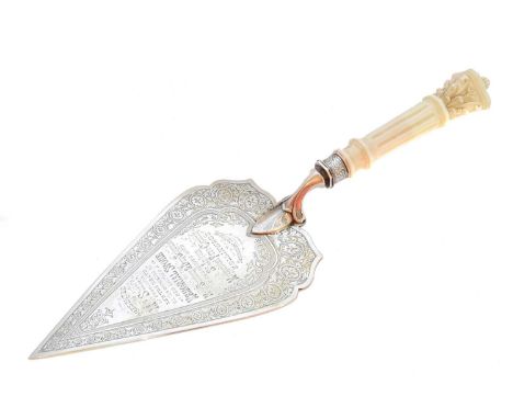 A Victorian silver presentation trowel, of typical form, the engraved trowel with carved ivory columnar handle, hallmarks for