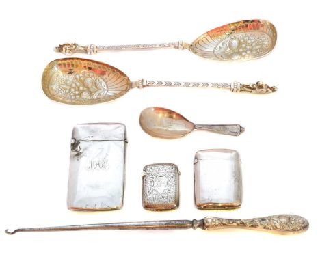 A selection of silver and white metal items, to include two silver vesta cases, a silver cigarette case, a caddy spoon, a sil