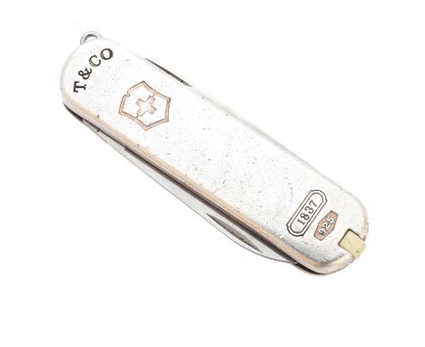 A silver Swiss army knife by Tiffany &amp; Co. and Victorinox, with knife, scissors, file, toothpick and tweezers, hallmarks 