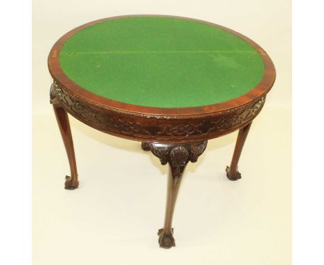 Edwardian mahogany fold over card table, semi-circular shape, blind fretwork to frieze, four supports each with shell motif t