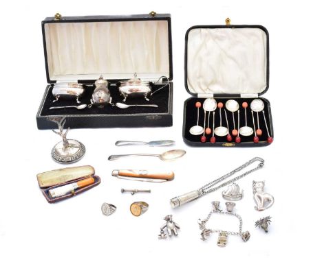 A selection of silver, to include a cased Elizabeth II silver cruet set, a cased silver coffee spoon set, a silver and mother