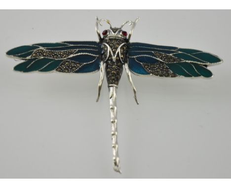 A large silver and enamel dragon fly brooch