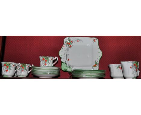 An early 20th Century Delphine Cherry pattern porcelain part tea service