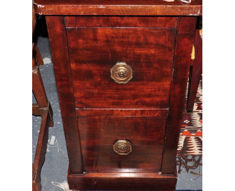 A 1920's mahogany bedside cabinet enclosed by two doors, h:81cm together with a 1920's mahogany standard lamp