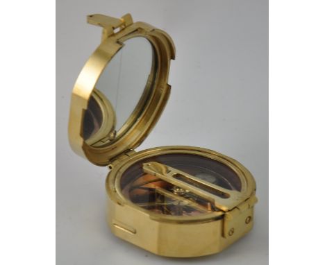 A brass compass, unfolding into astronomical instrument 