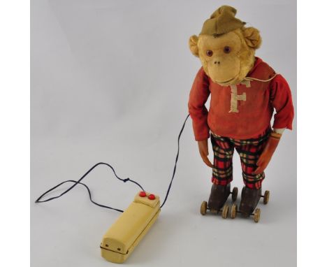 1950's Japanese tinplate and plush (battery operated) Flippy the monkey roller skating toy, in full working condition