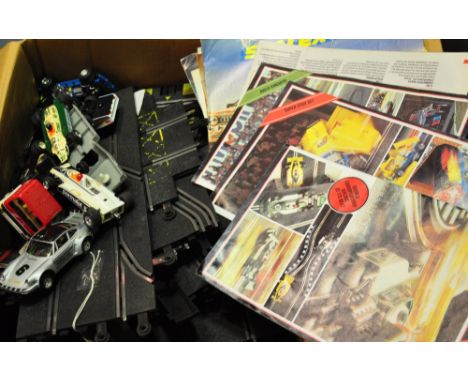 An assortment of vintage Scalextric including track and assorted vehicles 