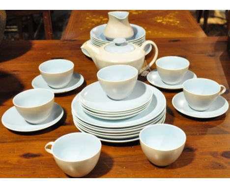 A thirty piece Poole two tone blue and grey tea/dinner  service, comprising teapot, sugar bowl, milk jug, six cups and four s