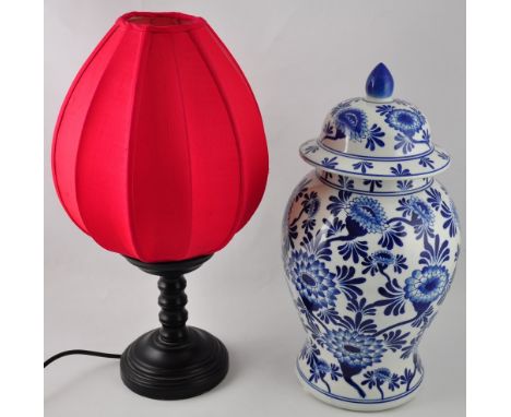 A Chinese blue and white lidded baluster vase, together with a table lamp with a red shade