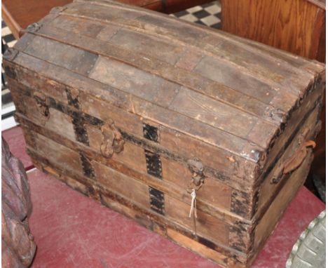A late Victorian wood bound domed top travelling trunk