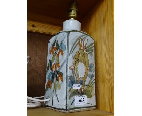 A table lamp with painted design of hares by Colin Kellam