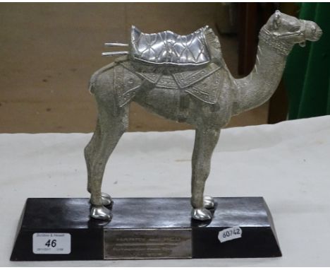 A silvered model of a camel with 1977 presentation plaque