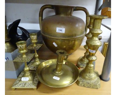 A brass urn, 2 pairs of candlesticks and a chamber stick