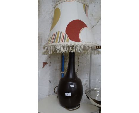 A pottery table lamp and shade.