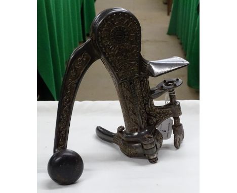 An Edwardian embossed and polished cast iron "Original Safety" bar top corkscrew