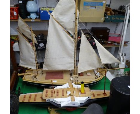 Painted wood model sailing ship and a painted wood paddle steamer, on stand
