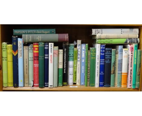 Shelf of books about cricket