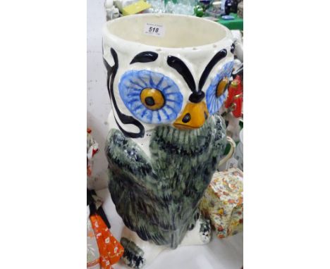 A glazed pottery owl figure stick stand