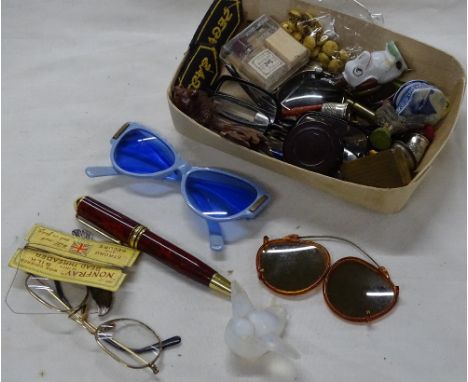 French glass bird, vintage sunglasses, badges, etc.