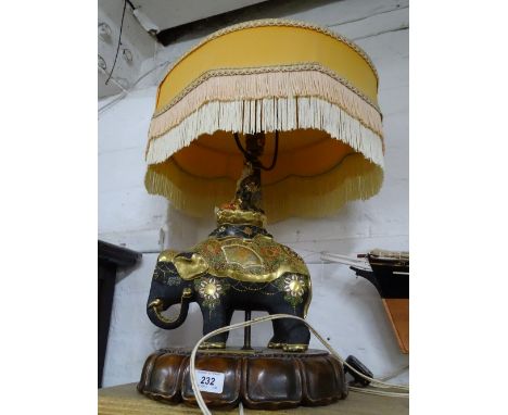 An elephant figure table lamp on stand, bearing plaque "From the Society of Laundry Engineers"