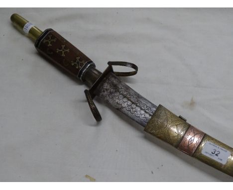 An Eastern ceremonial sword and scabbard