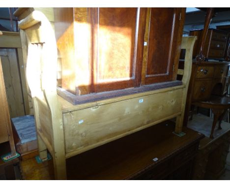 A Polished pine slatted hall bench with rising seat