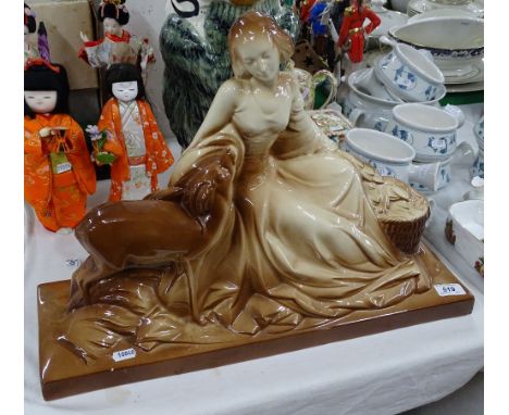 An Art Deco ceramic girl with deer
