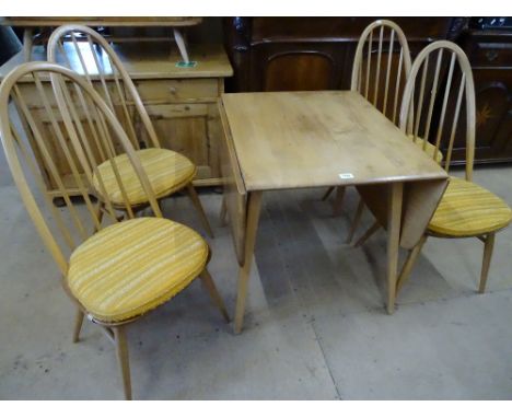 An Ercol elm & beech Windsor drop leaf dining table,length 2' extending to 4' 6", depth 2' 5" height 2'4", together with 4 ma