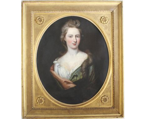 FOLLOWER OF SIR GODFREY KNELLER, Bt. (1646-1723) PORTRAIT OF A YOUNG LADY Quarter length, wearing a blue-green mantle, oil on