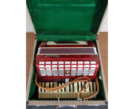 A Parrot piano accordion in case
